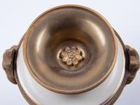 A Pair of Sèvres Style Gilt Bronze Mounted Painted and Parcel Gilt Porcelain Urns