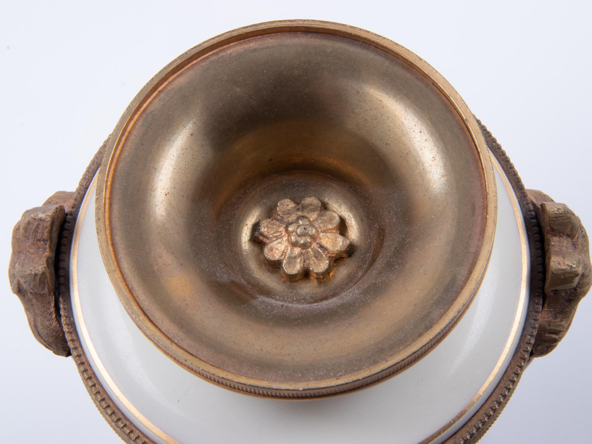 A Pair of Sèvres Style Gilt Bronze Mounted Painted and Parcel Gilt Porcelain Urns