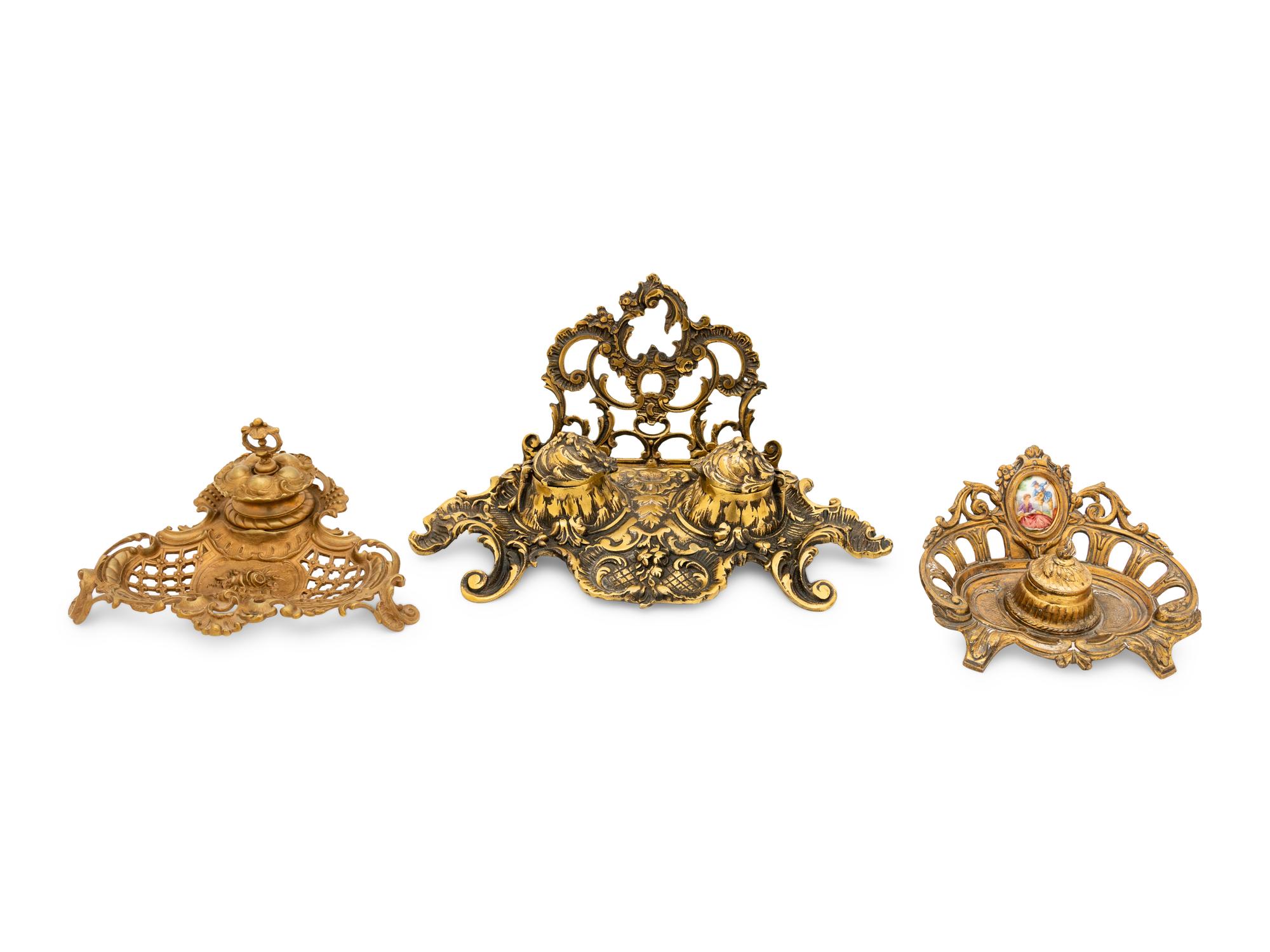 A Group of Continental Brass and Bronze Inkwells and Candlesticks