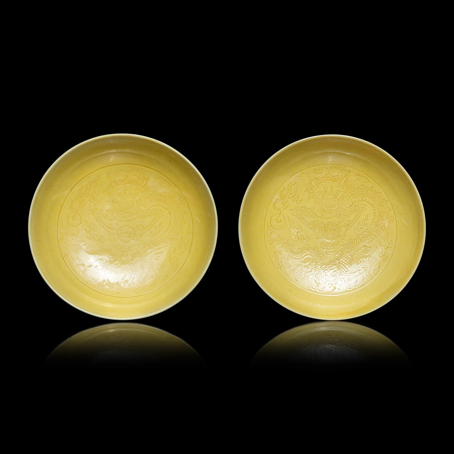 A Pair of Chinese Yellow Glazed Incised Porcelain 'Dragon' Dishes, Qianlong Marks and of the Period 清乾隆 嬌黃釉龍紋碟一對