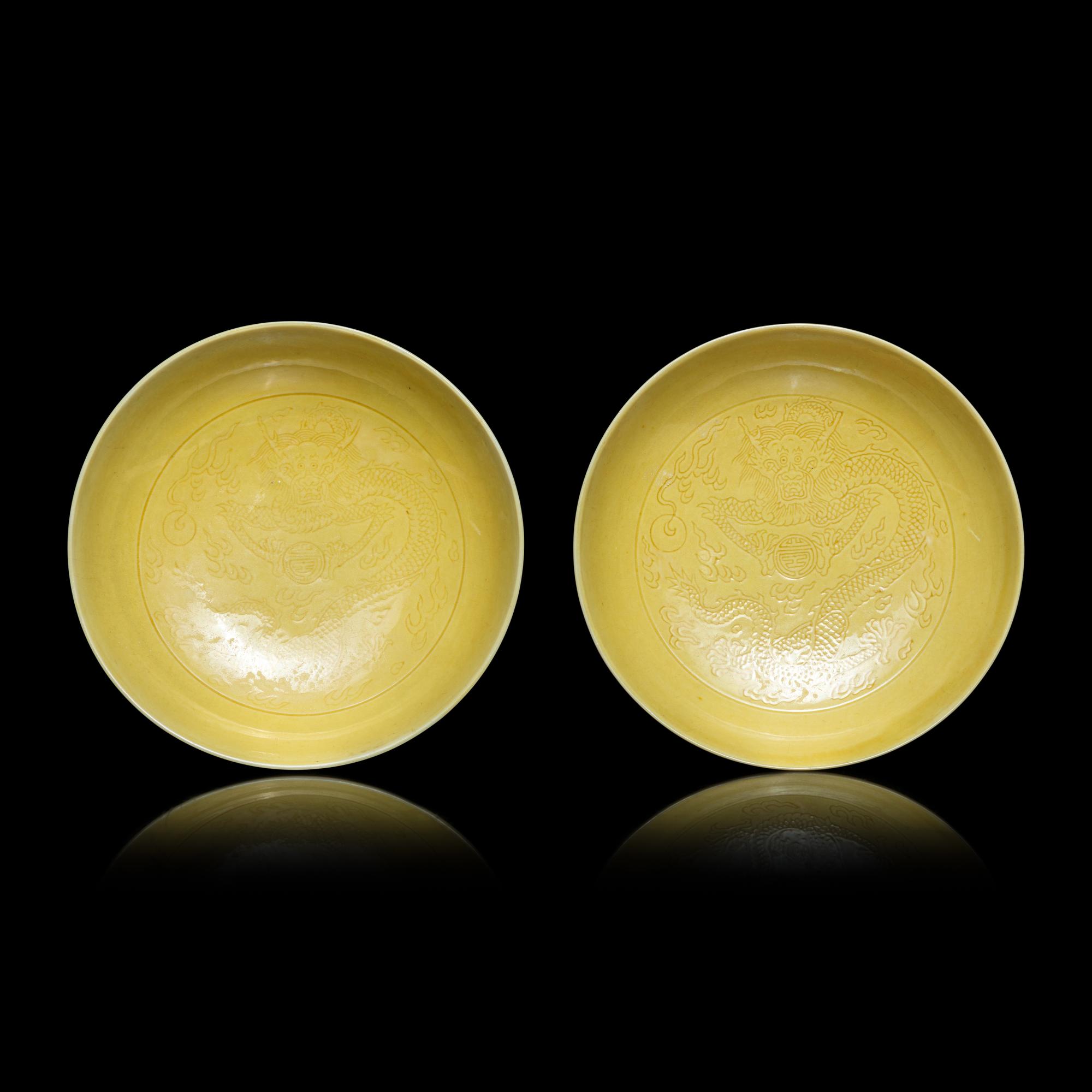 A Pair of Chinese Yellow Glazed Incised Porcelain 'Dragon' Dishes, Qianlong Marks and of the Period 清乾隆 嬌黃釉龍紋碟一對