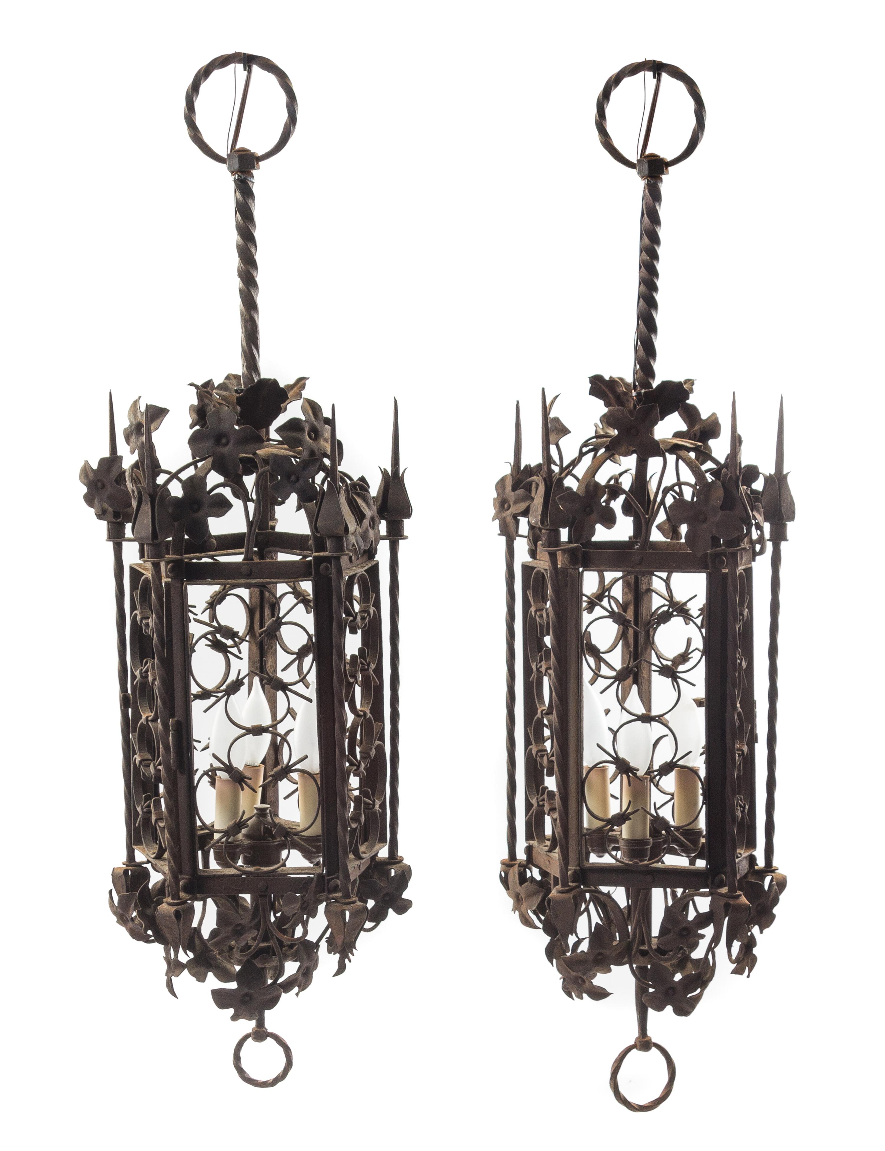 A Pair of Gothic Style Wrought Iron Lanterns Height 35 inches. — STYLE OF ADDISON MIZNER