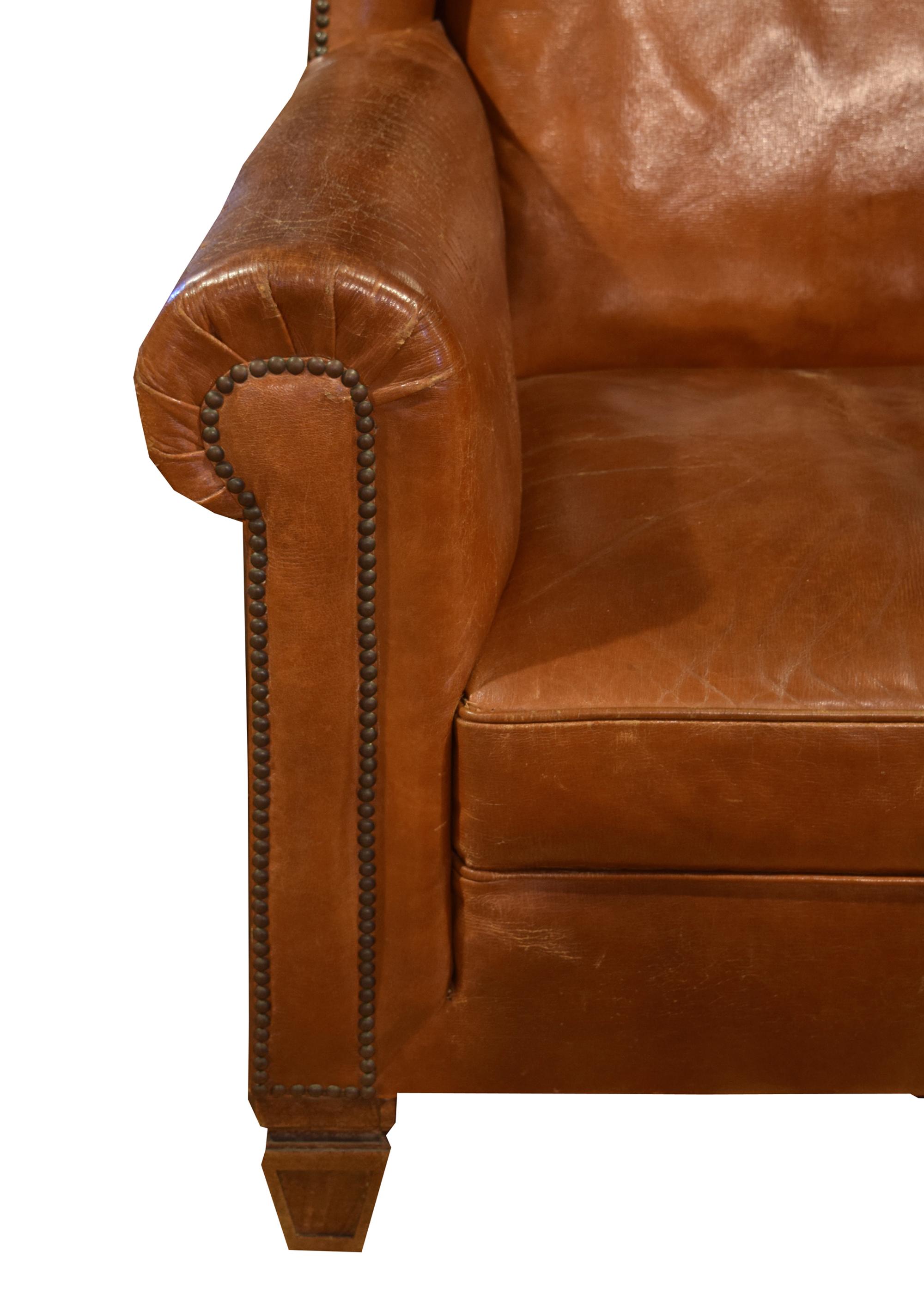 A Leather Upholstered Wingback Chair 34.5" W x 30" D x 41" H — Italy, Circa 1910