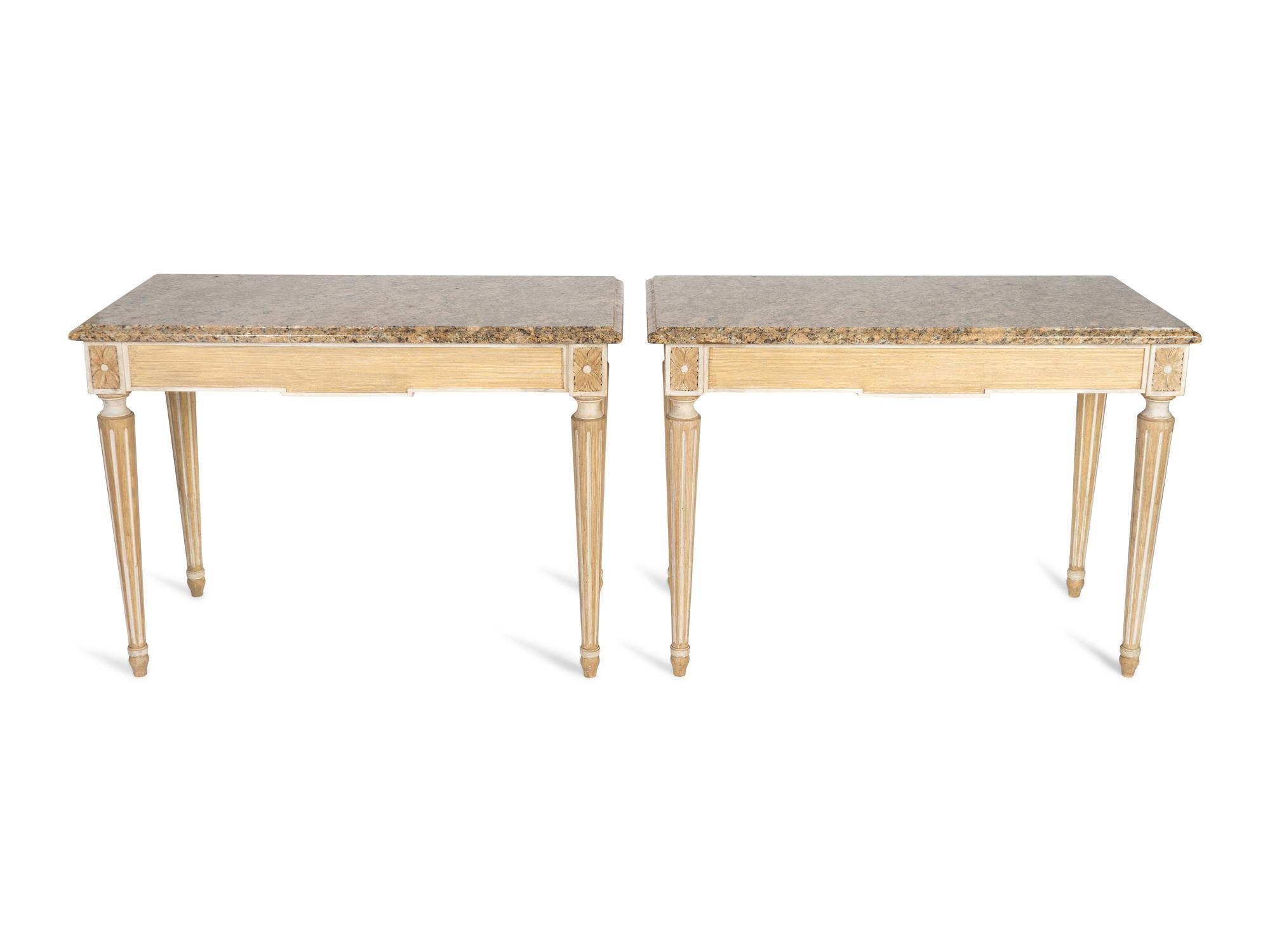 A Pair of Neoclassical Carved and Painted Console Tables with Granite Tops — 20TH CENTURY