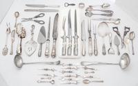 An Assortment of Silver and Silver-plate Flatware Length of longest 14 inches.