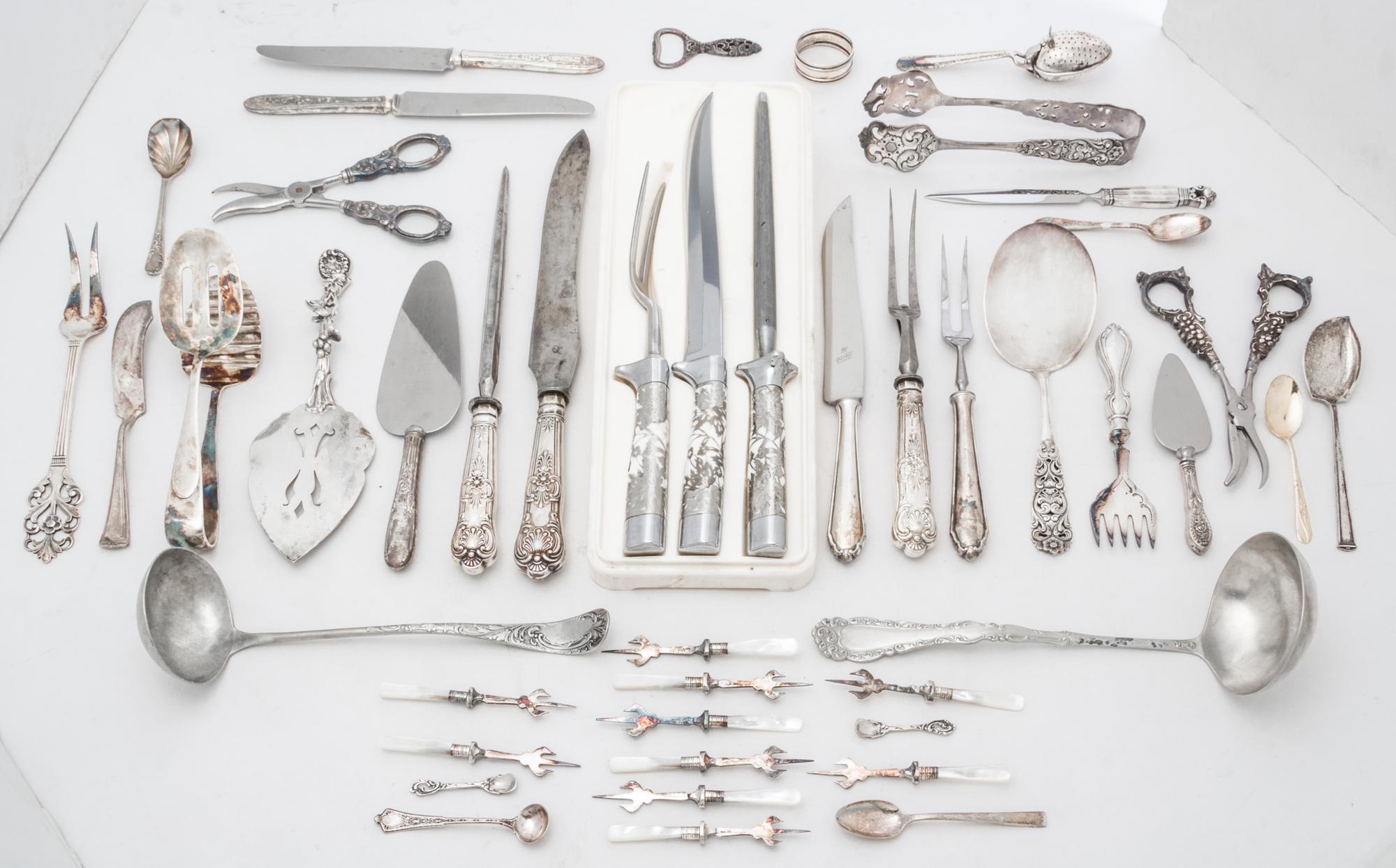 An Assortment of Silver and Silver-plate Flatware Length of longest 14 inches.