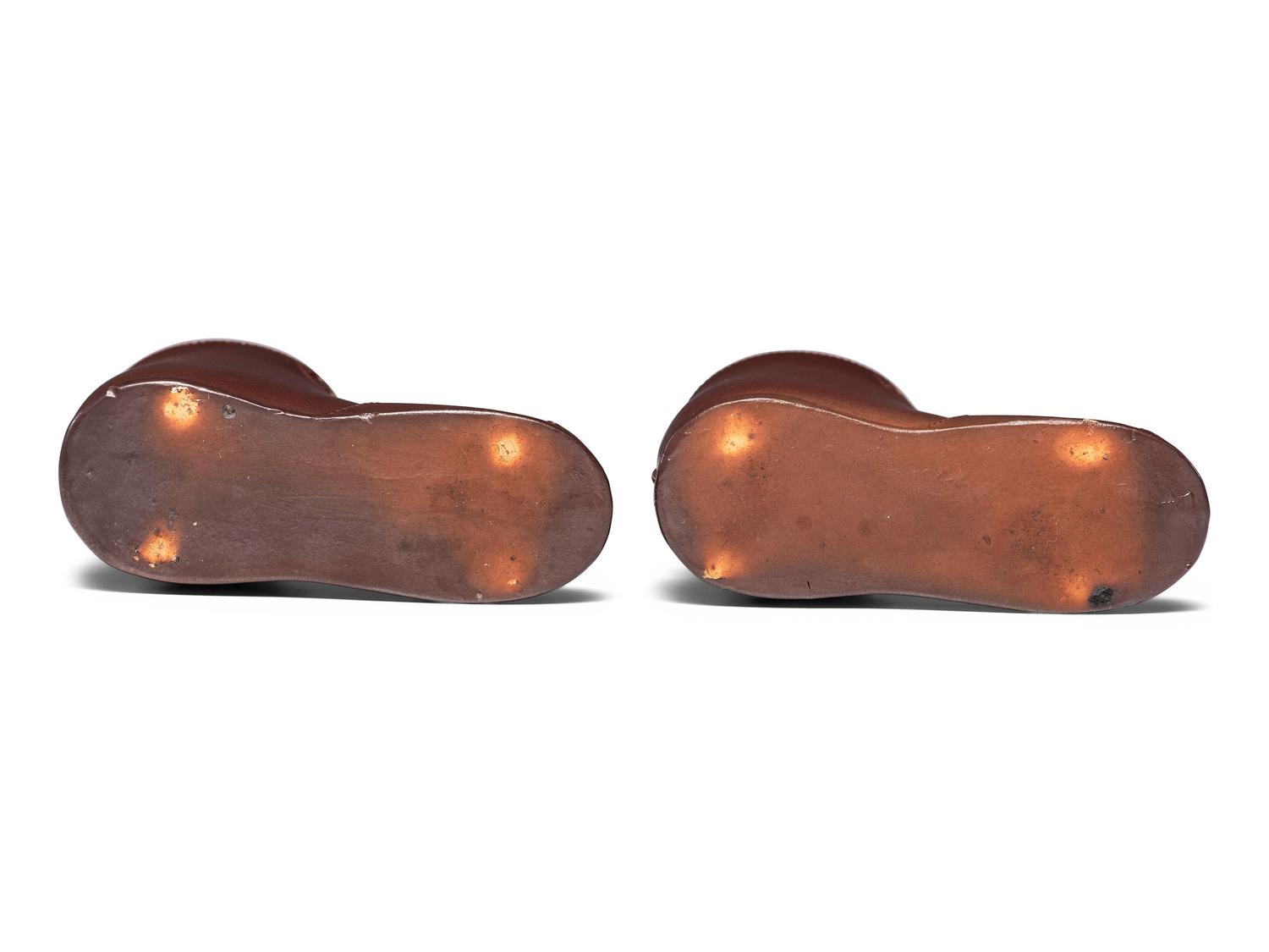 A Pair of Finely Crafted Glazed Pottery Shoes