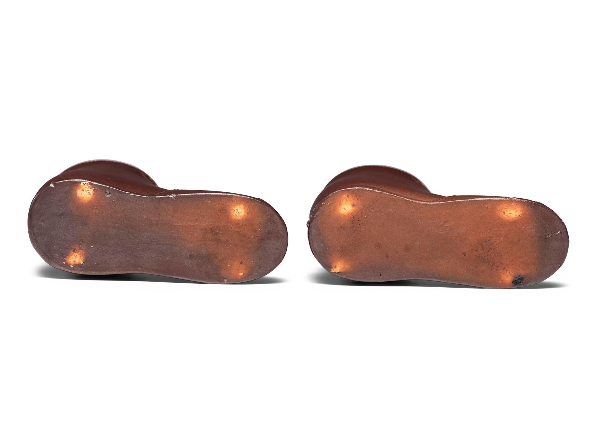 A Pair of Finely Crafted Glazed Pottery Shoes