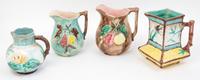 Four Majolica Pitchers Height of tallest 7 1/2 inches.