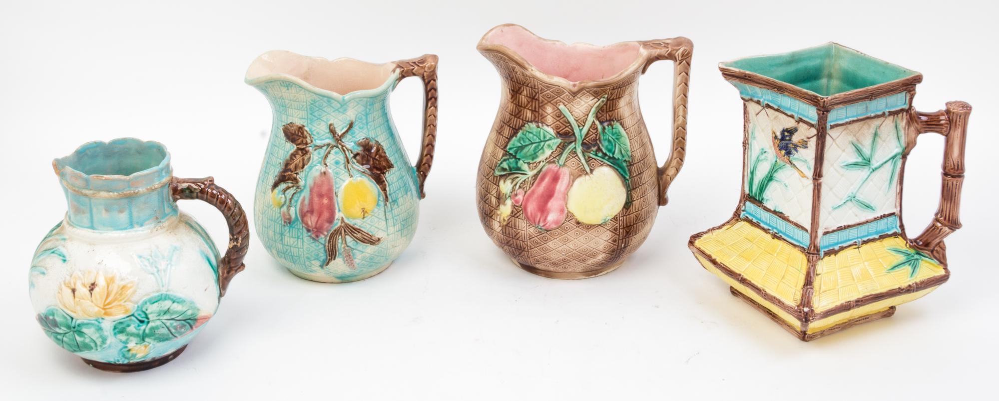 Four Majolica Pitchers Height of tallest 7 1/2 inches.