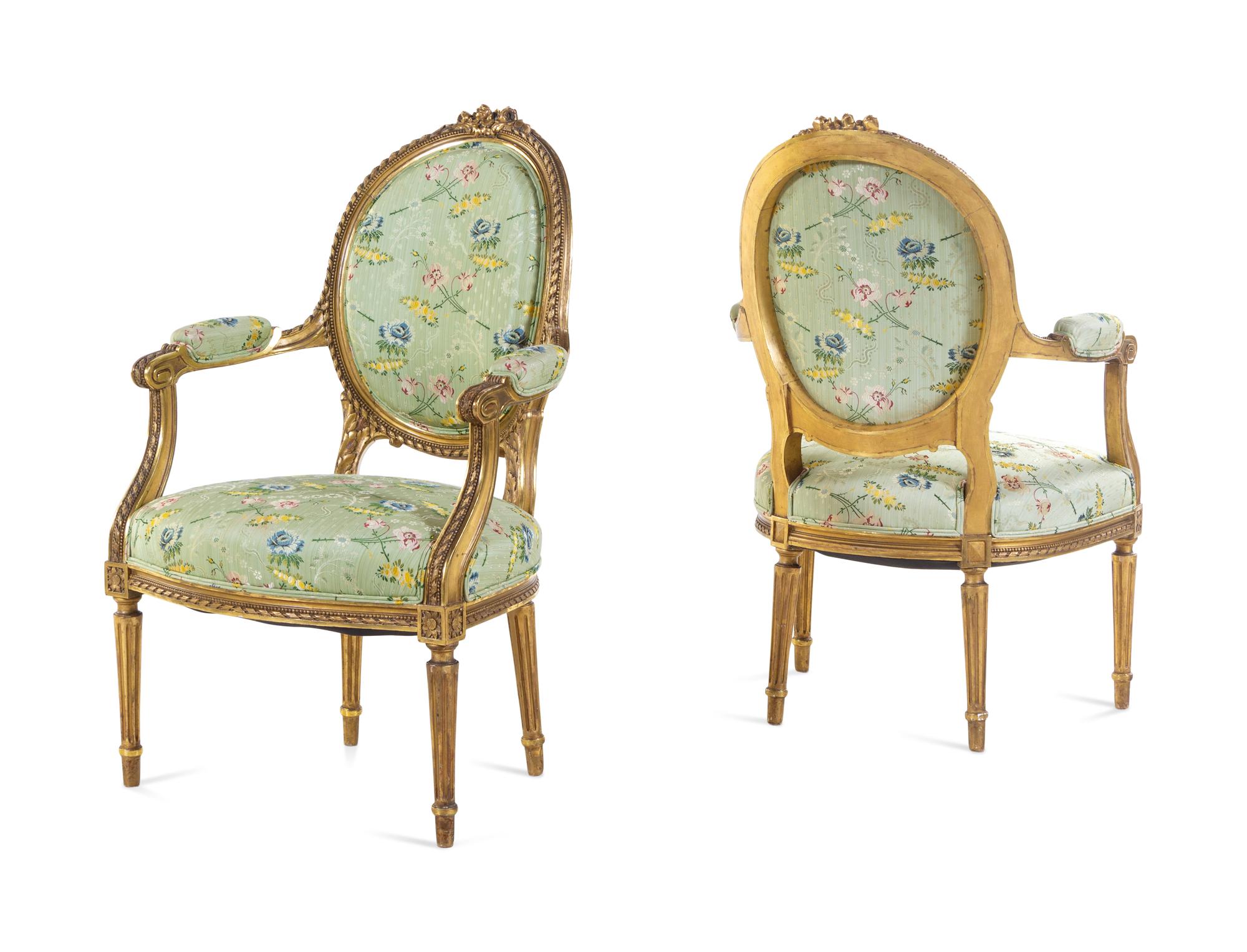 A Set of Four Louis XVI Style Carved Giltwood Fauteuils