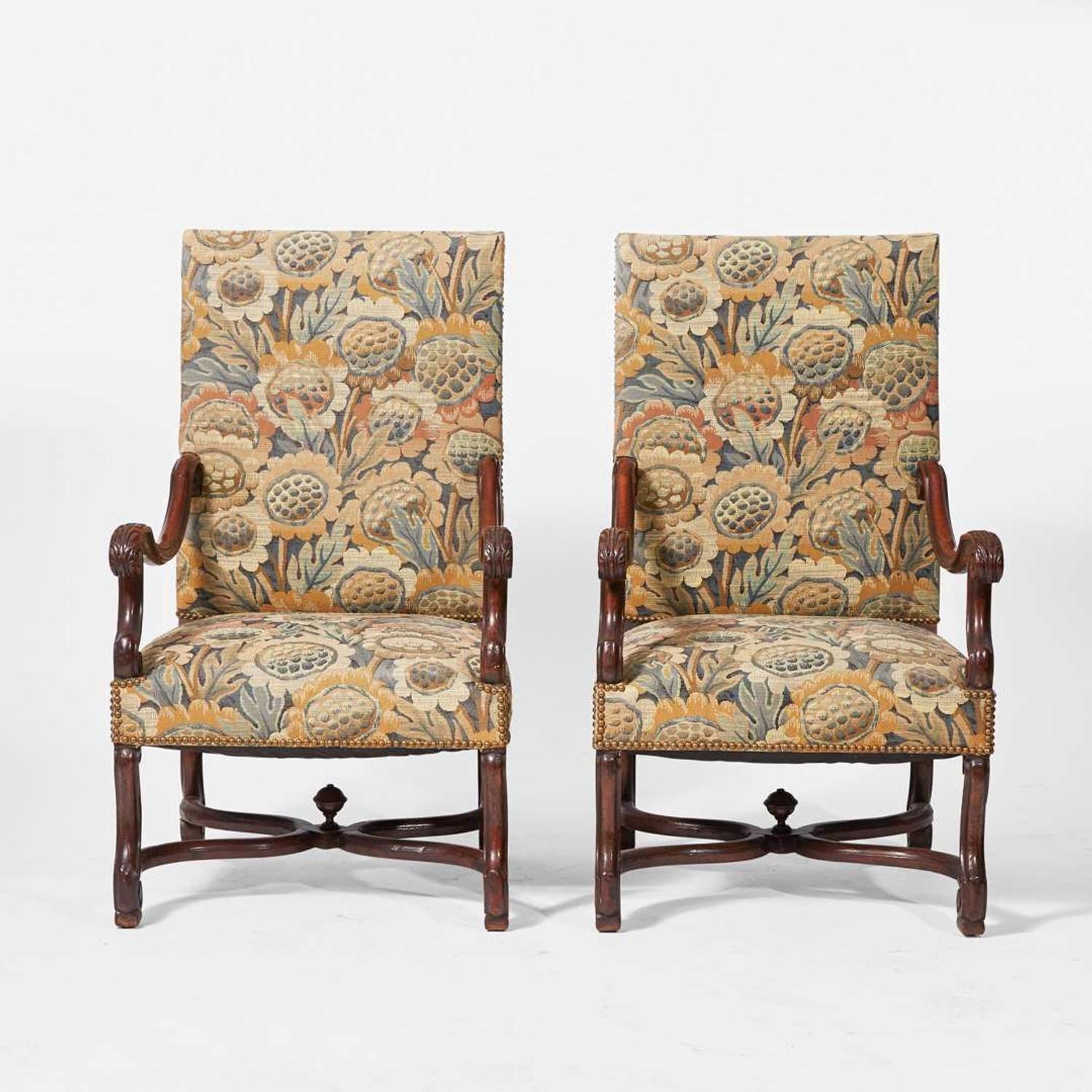 A pair of Baroque Revival carved walnut armchairs late 19th / early 20th century