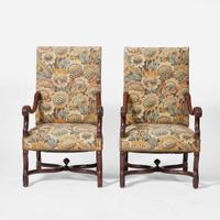 A pair of Baroque Revival carved walnut armchairs late 19th / early 20th century