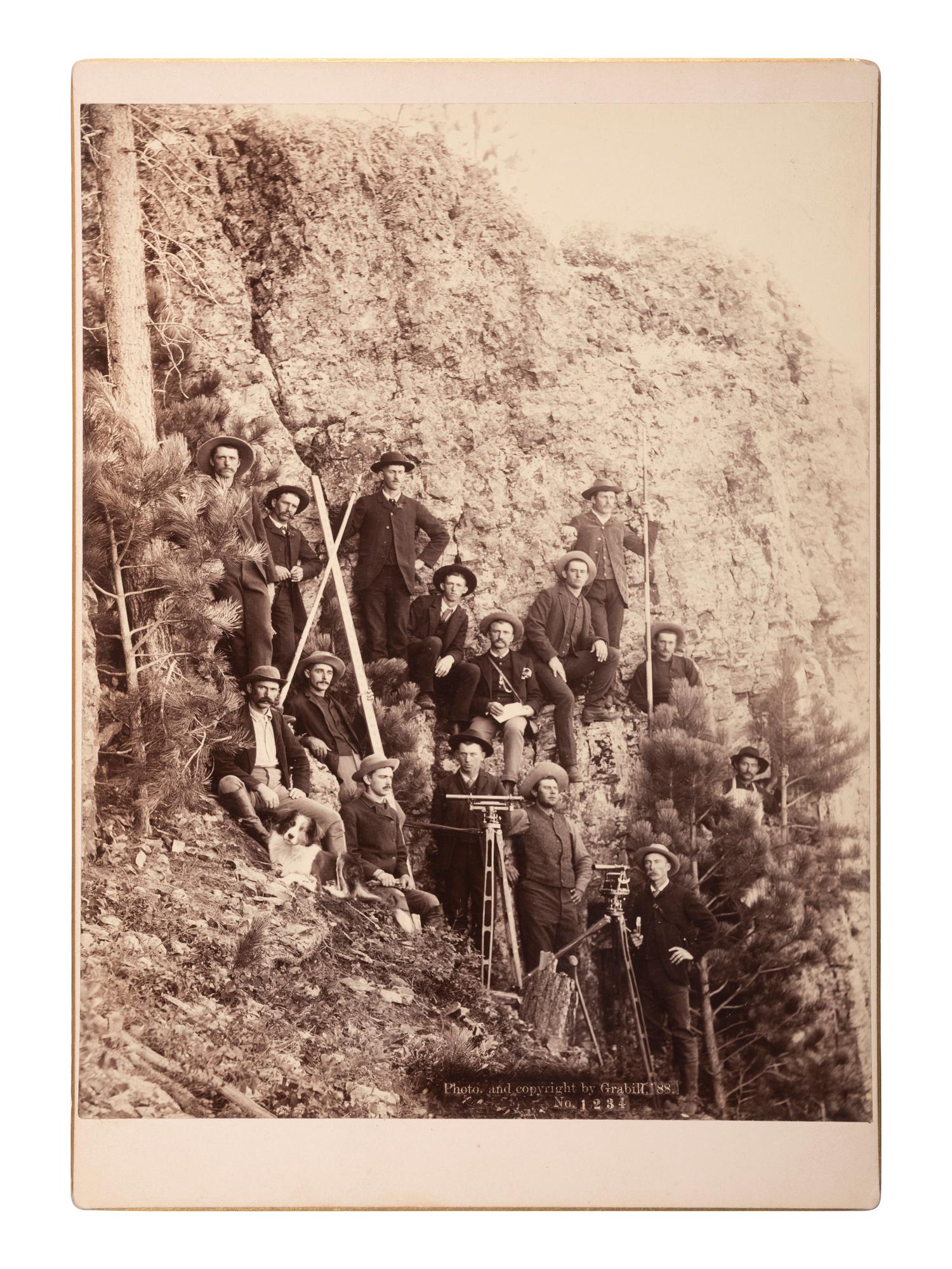 [WESTERN AMERICANA]. A group of 2 photographs of surveyors with equipment, incl. example by John C.H. GRABILL, South Dakota, 1888.