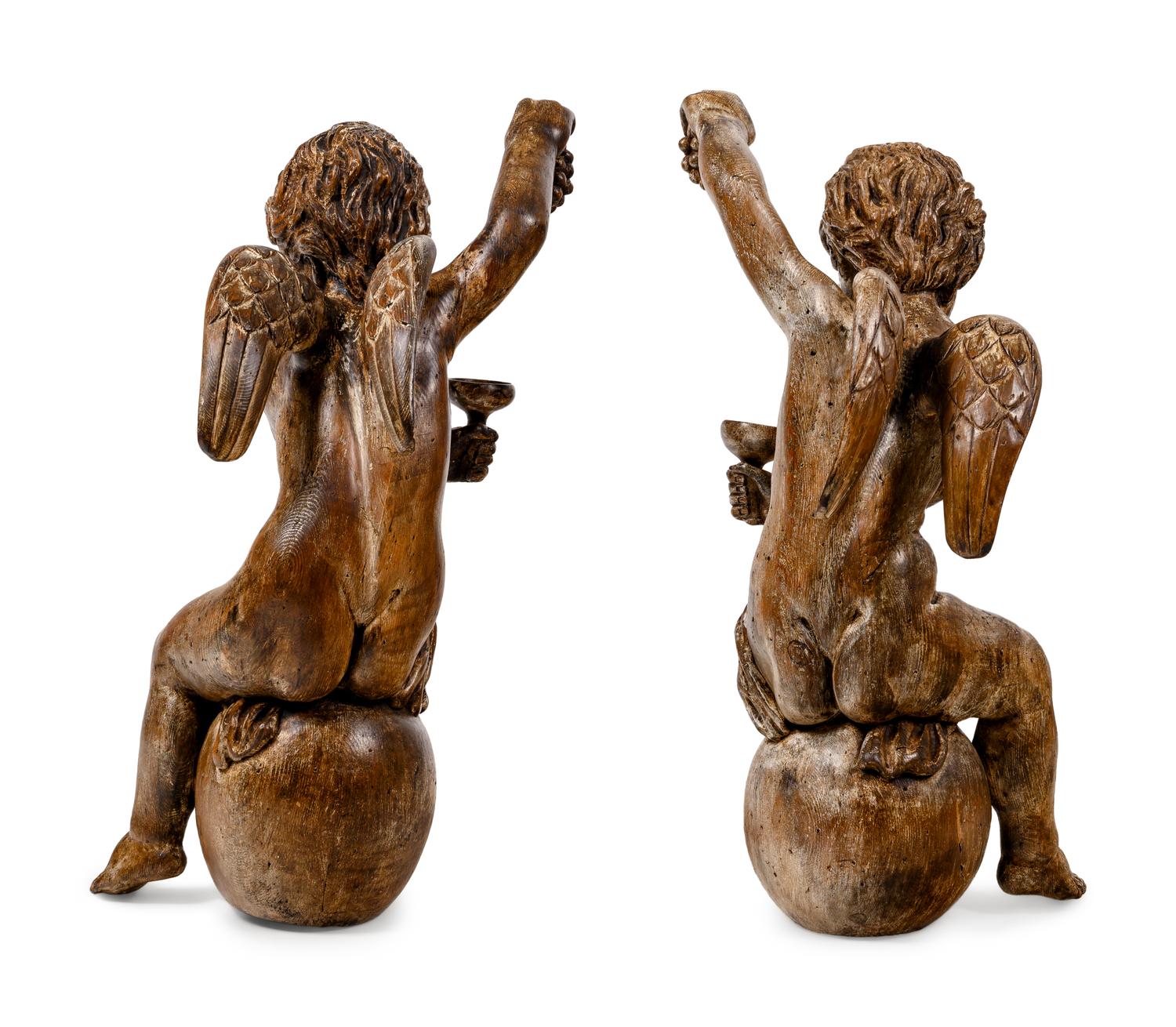 A Pair of Continental Carved Oak Cherubs