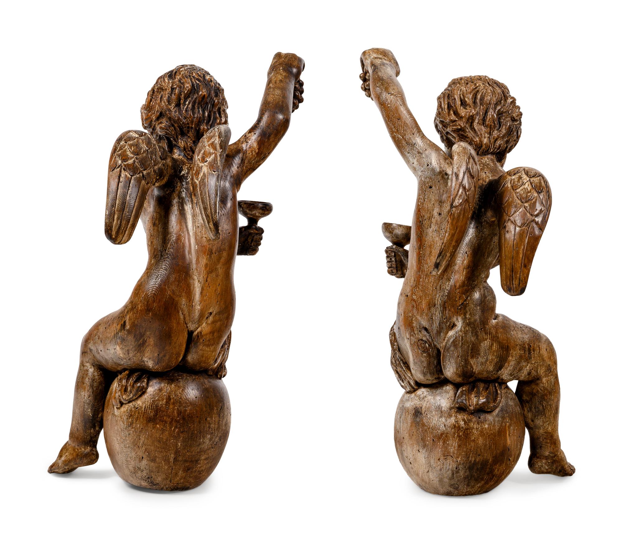 A Pair of Continental Carved Oak Cherubs