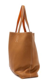 An Hermes Orange/Gold 45cm Taurillon Clemence Double Sens Tote, 17.5" x 15.5" x 5".