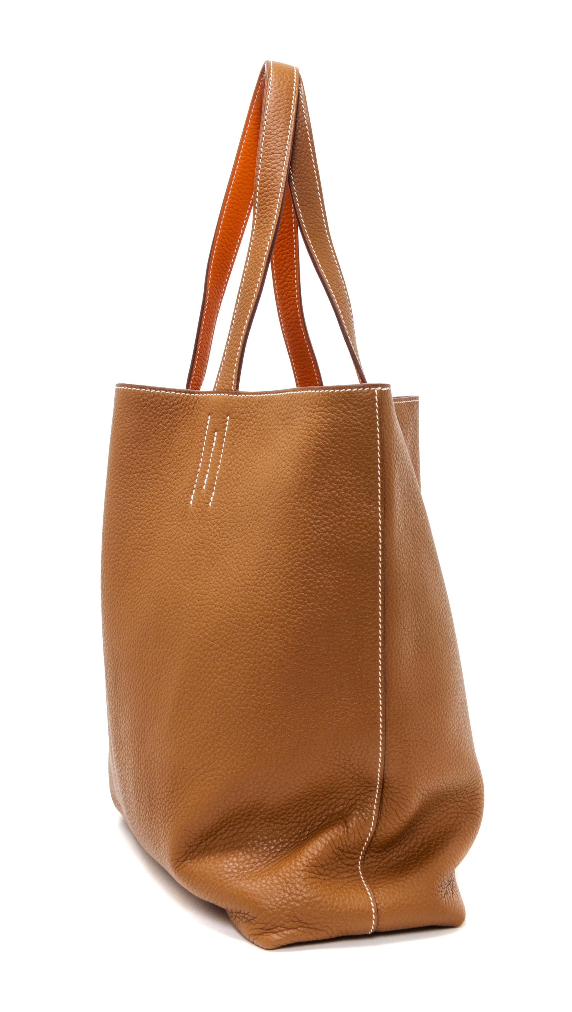 An Hermes Orange/Gold 45cm Taurillon Clemence Double Sens Tote, 17.5" x 15.5" x 5".