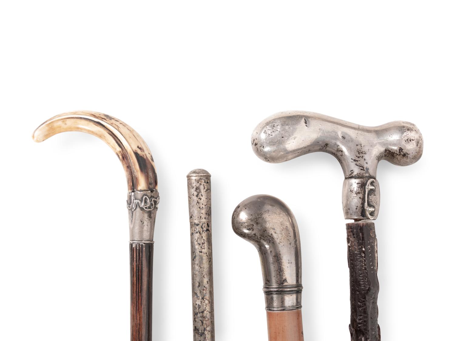 A Collection of Eight Silver and Silvered Metal Canes and Walking Sticks