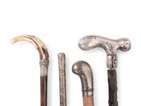 A Collection of Eight Silver and Silvered Metal Canes and Walking Sticks