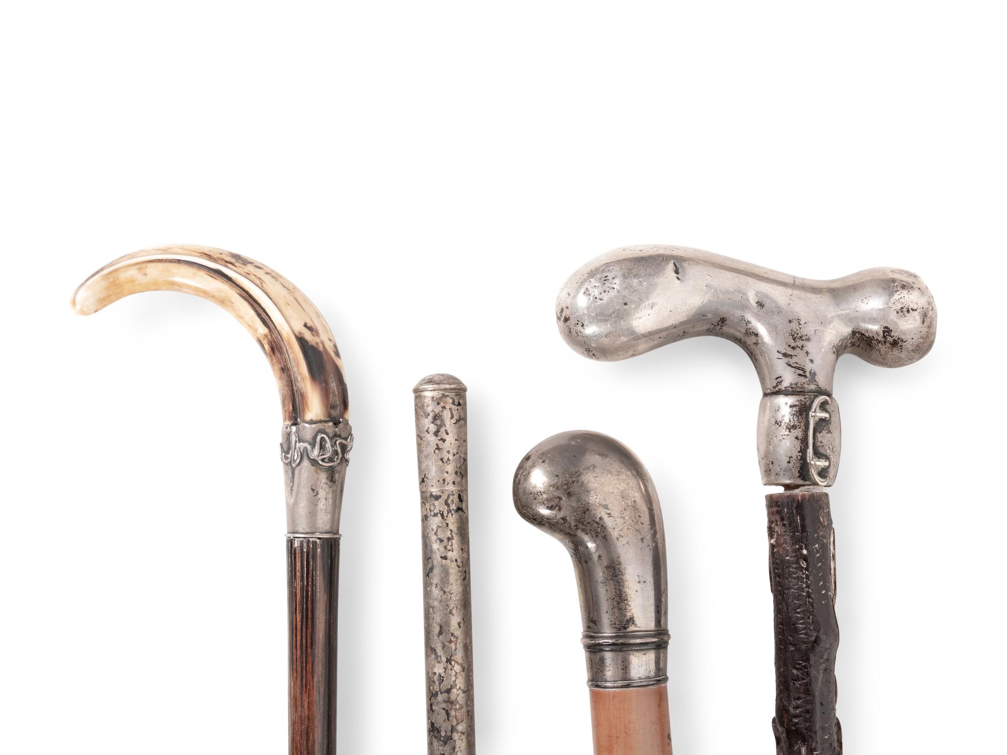 A Collection of Eight Silver and Silvered Metal Canes and Walking Sticks
