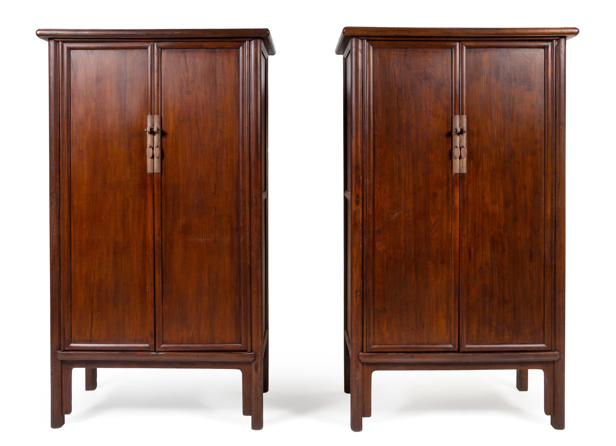 A Large Pair of Elmwood Cabinets, Yuanjiaogui Each height 88 x width 47 x depth 24 inches. — QING DYNASTY (1644-1911)