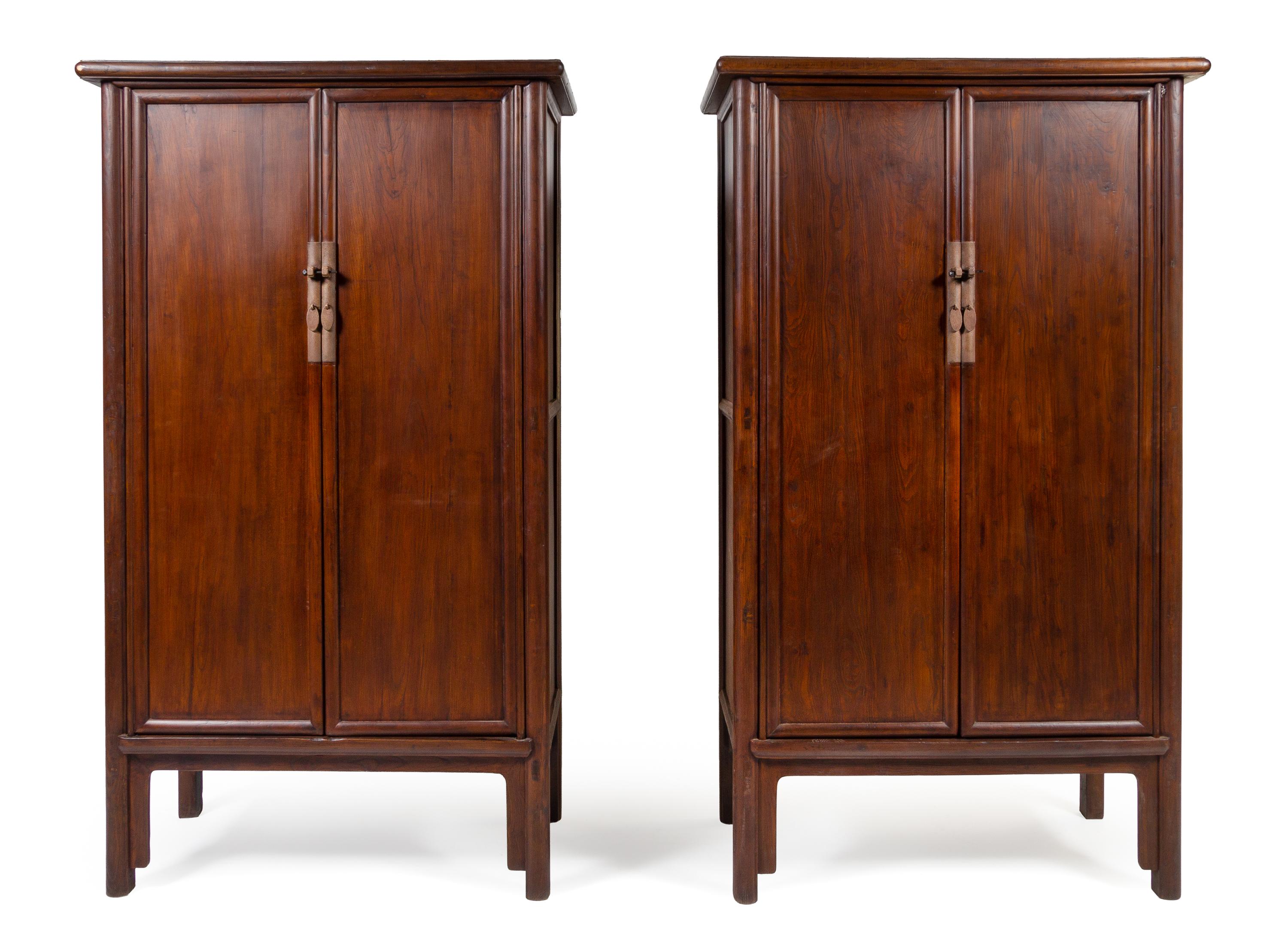 A Large Pair of Elmwood Cabinets, Yuanjiaogui Each height 88 x width 47 x depth 24 inches. — QING DYNASTY (1644-1911)