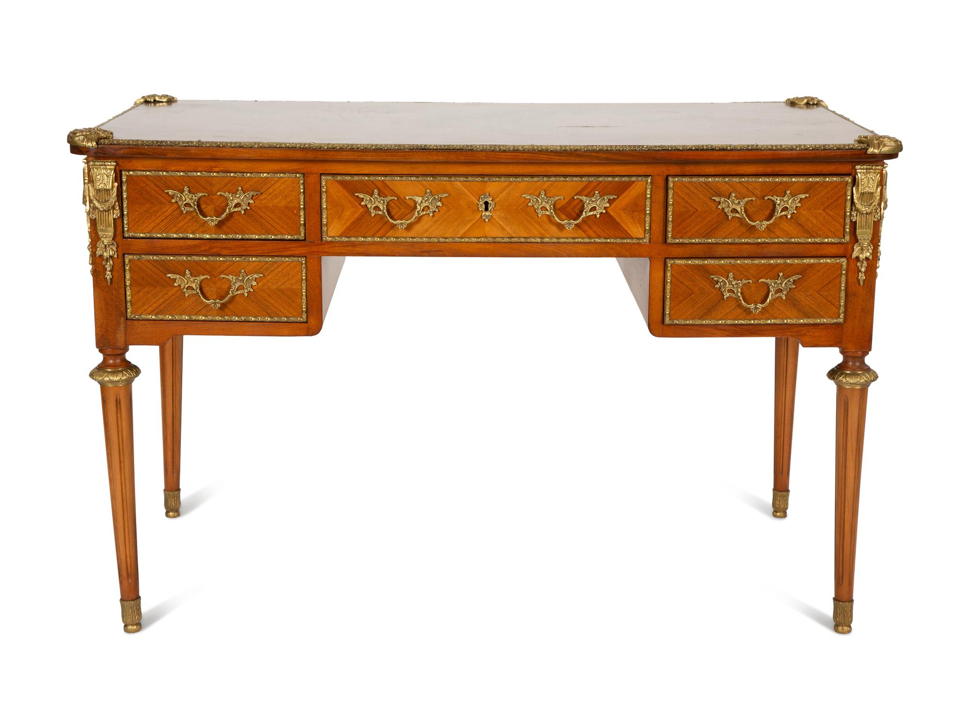 A Louis XVI Style Gilt-Bronze Mounted Mahogany Bureau Plat