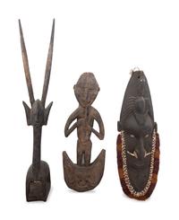 Ten African and New Guinean Masks and Carved Wood Articles
