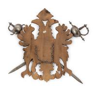 A Continental Carved Armor Trophy with Crossed Swords