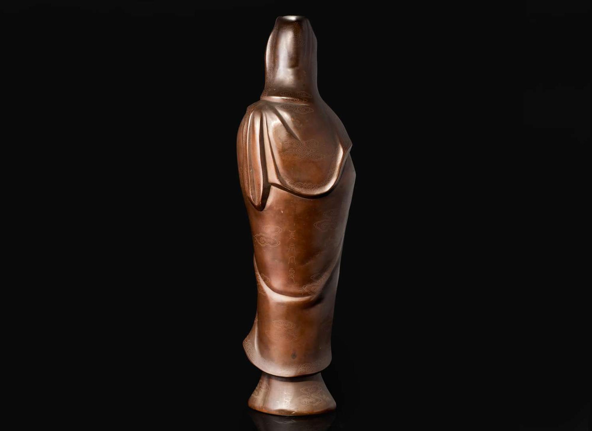 A large silver-inlaid bronze standing figure of Guanyin, signed Yu Tang Shi Sou 銅嵌銀觀音像 玉堂石叟款