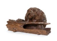 A Black Forest Carved Fruitwood Inkwell, Width 8 1/4 inches.