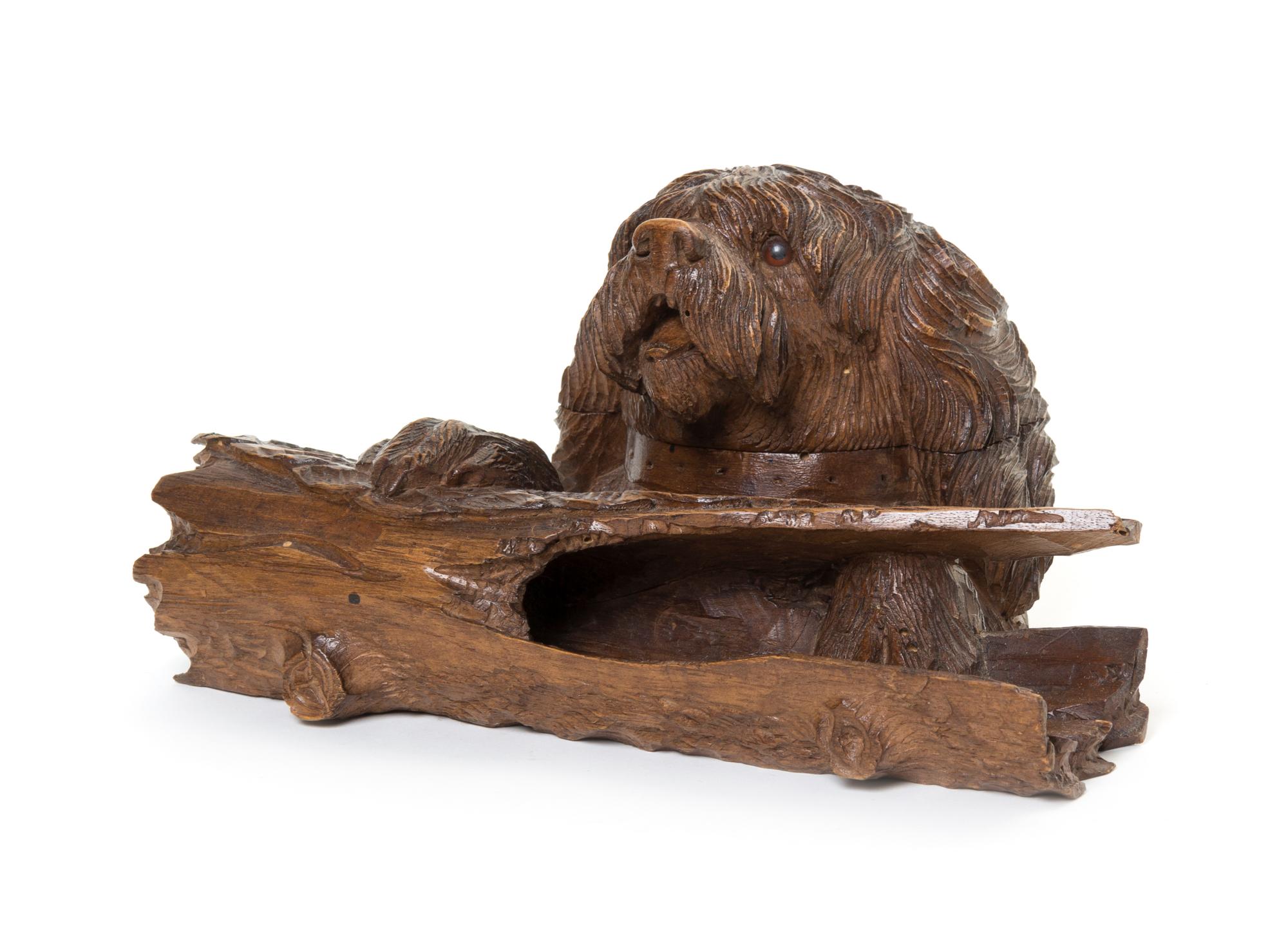 A Black Forest Carved Fruitwood Inkwell, Width 8 1/4 inches.