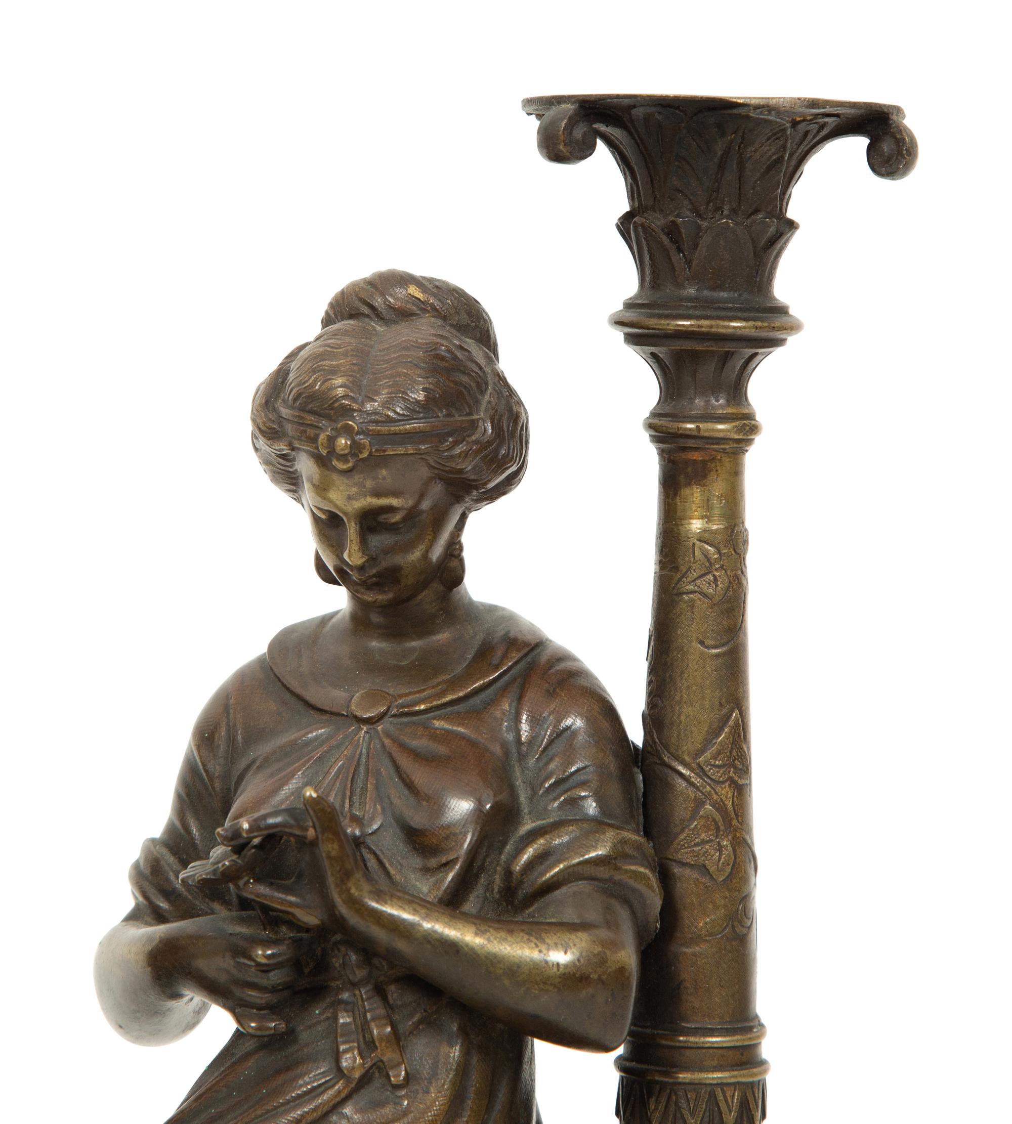 A Pair of French Bronze and Marble Figural Candlesticks