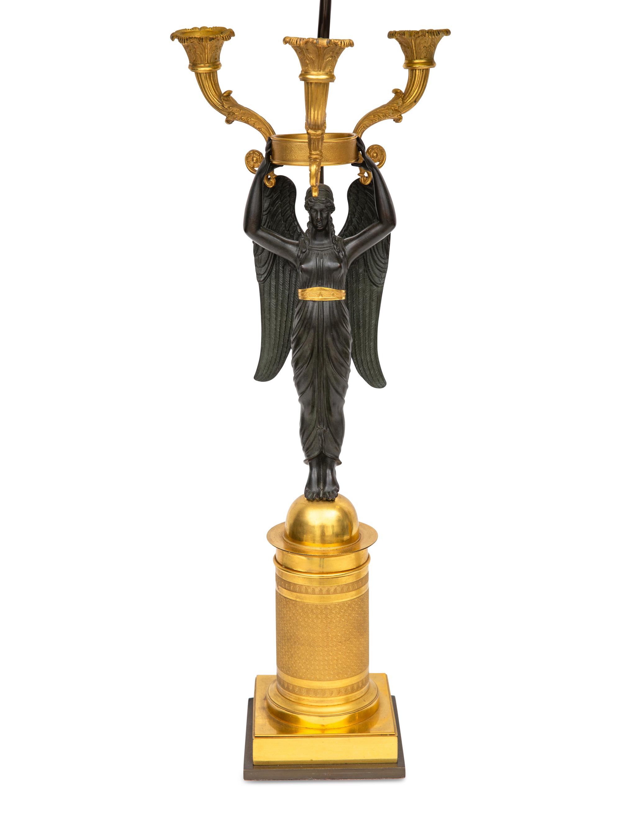 A Pair of Empire Style Gilt and Patinated Bronze Two-Light Figural Candelabra