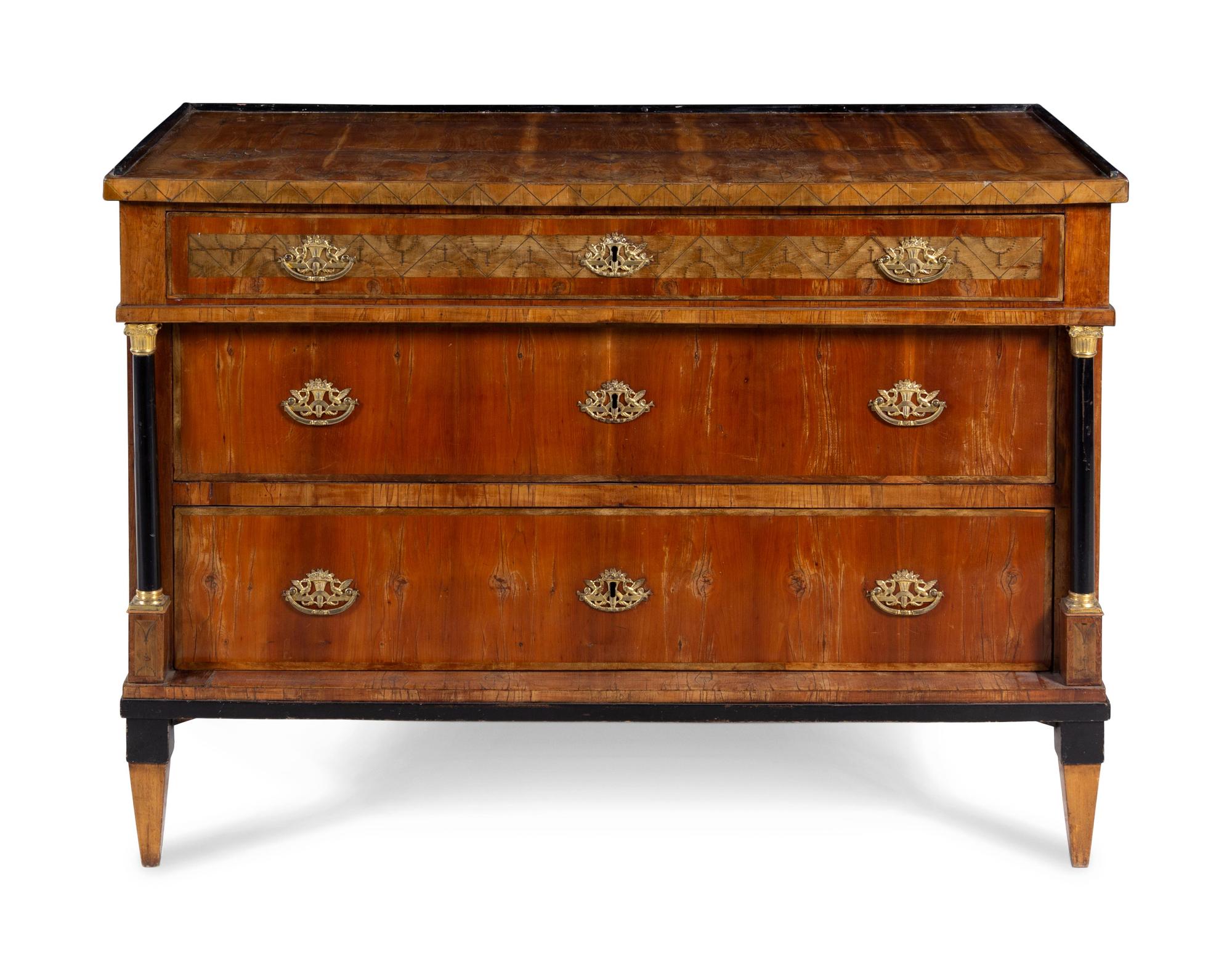 A Continental Inlaid and Parcel Ebonized Commode