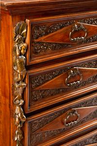 An Italian Baroque Style Walnut Chest of Drawers