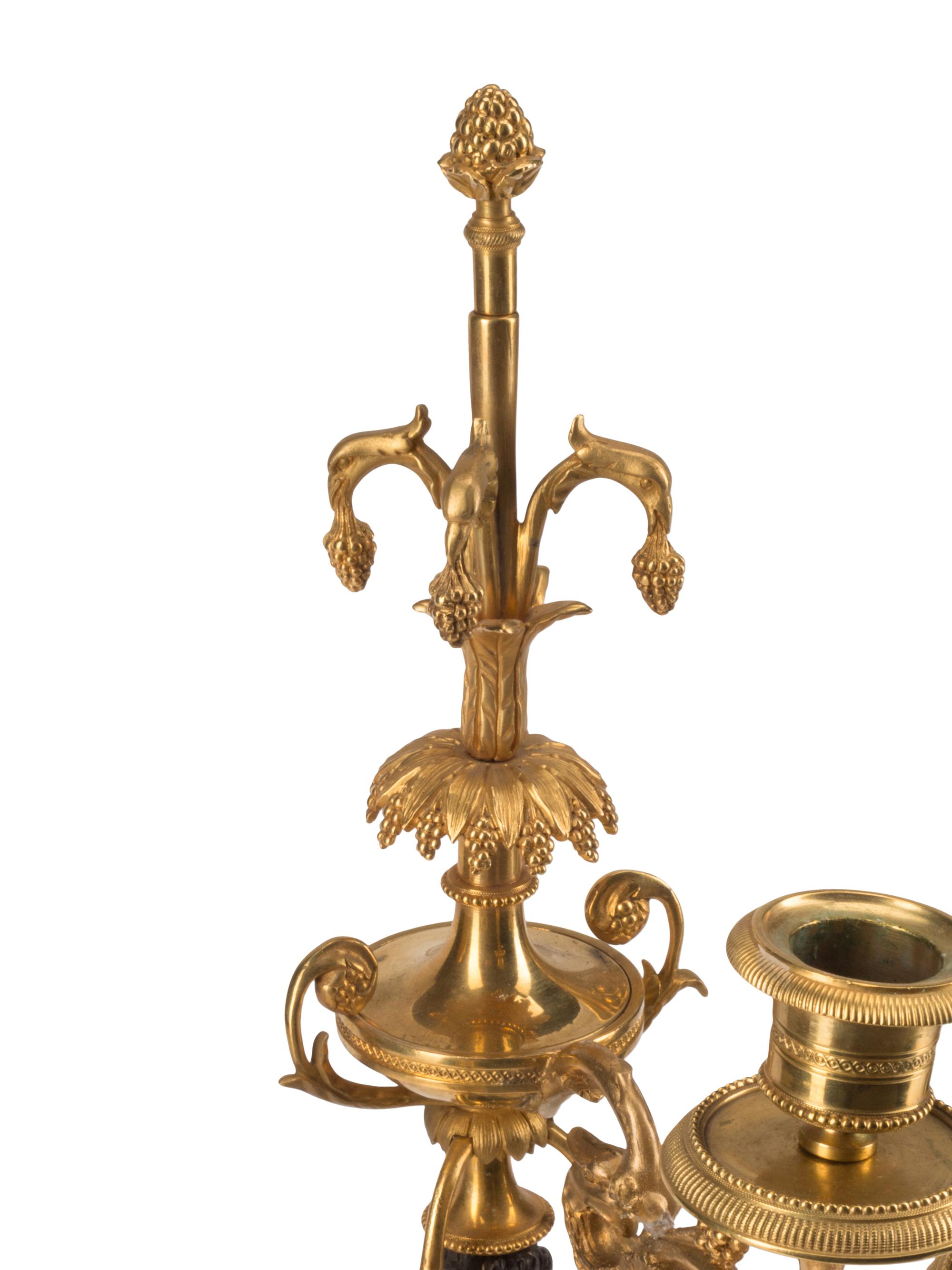 An Empire Gilt and Patinated Bronze Clock Garniture