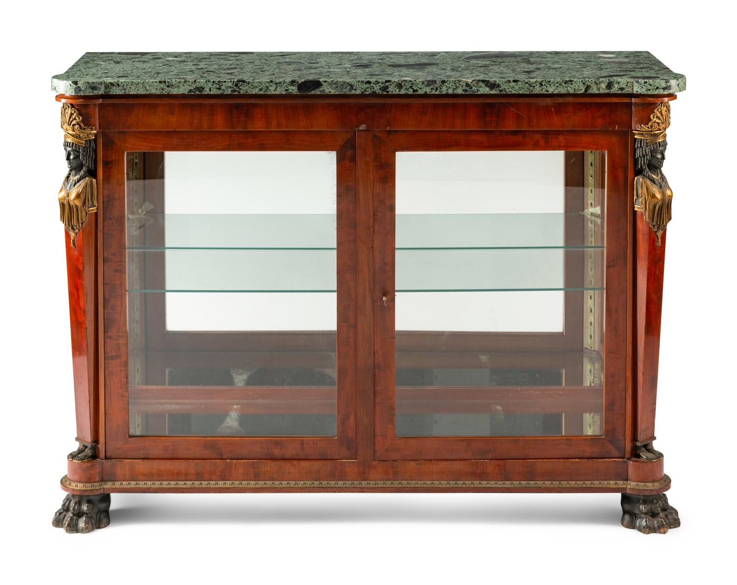 An Empire Egyptian Revival Style Gilt and Patinated Bronze Mounted Mahogany Cabinet