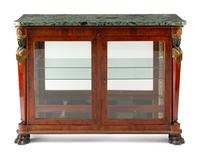 An Empire Egyptian Revival Style Gilt and Patinated Bronze Mounted Mahogany Cabinet