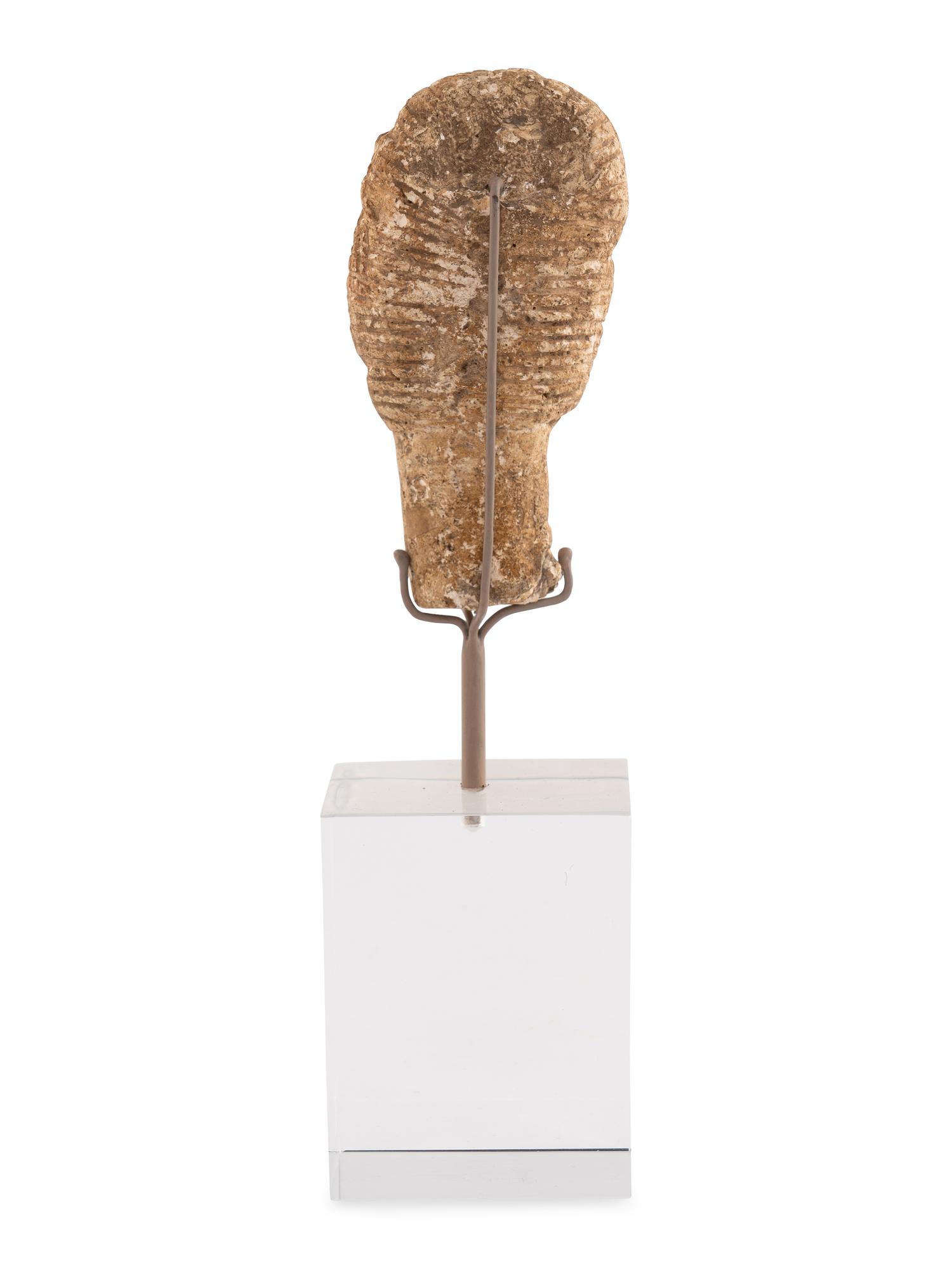 A Roman Stone Head of a Woman