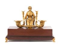 An Empire Style Gilt Bronze Mounted Mahogany Figural Encrier Length overall 12 inches.
