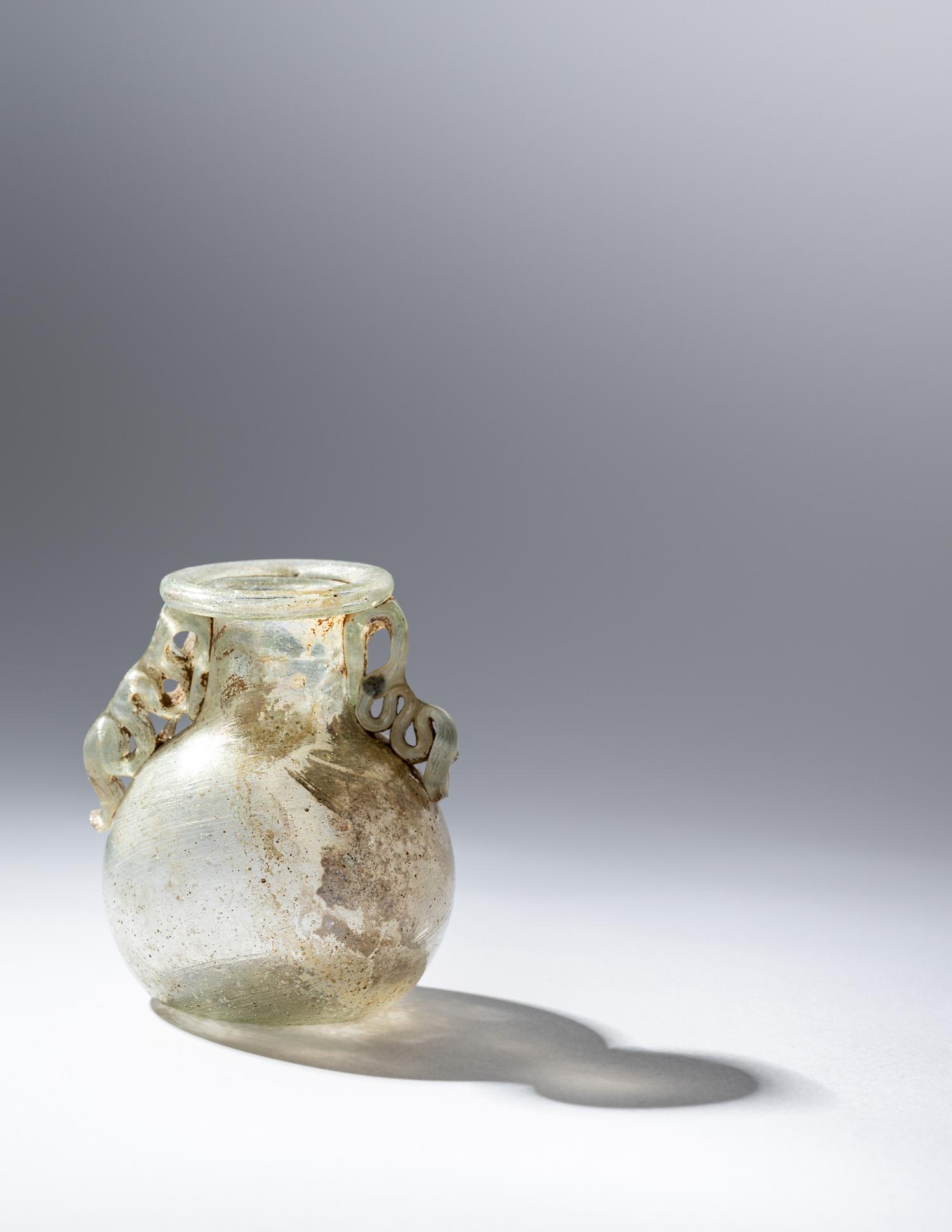 A Roman Green Glass Araballos