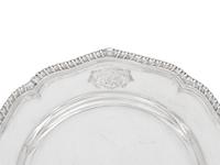 A Set of Twelve Silver Armorial Soup Plates