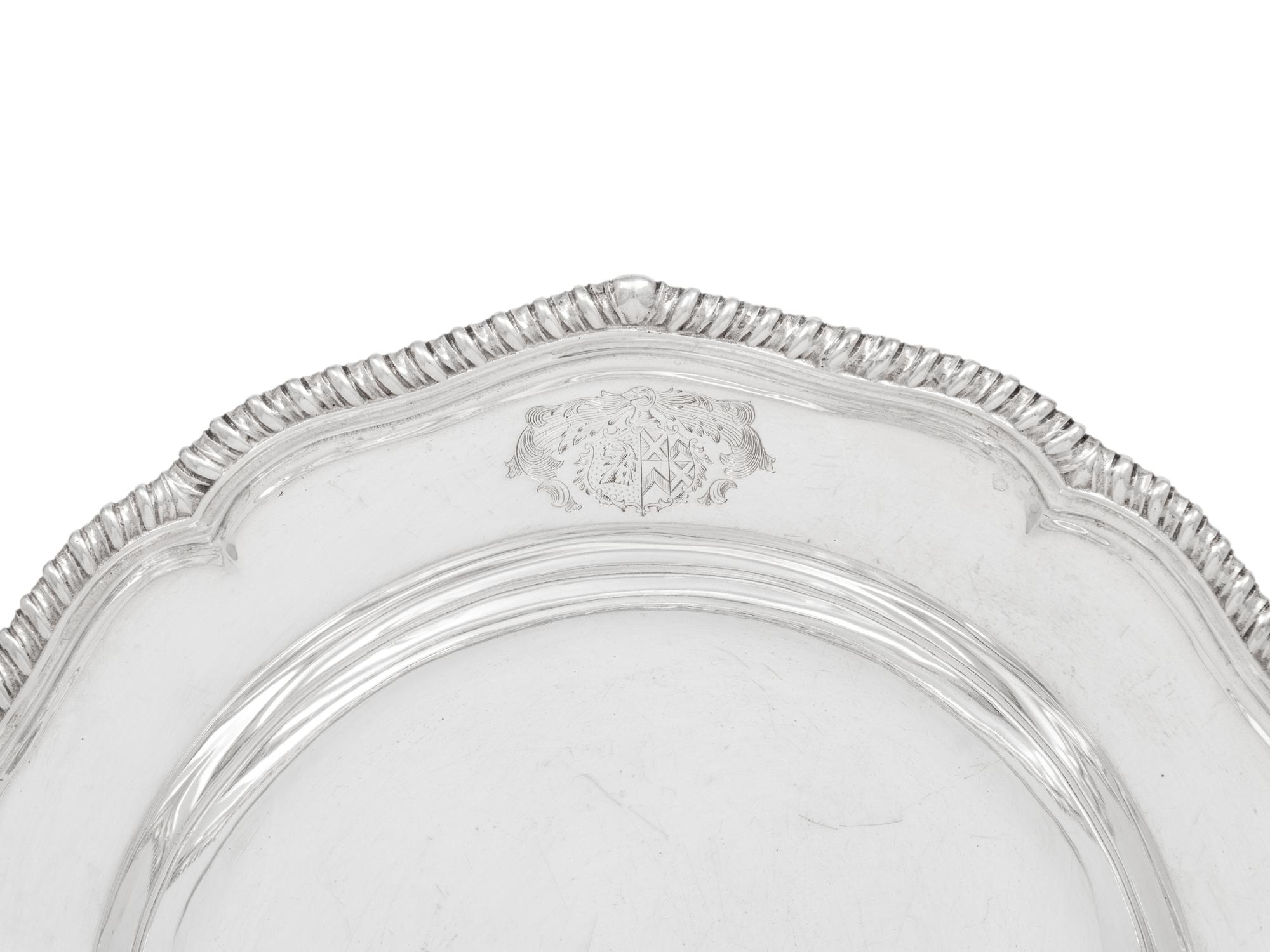 A Set of Twelve Silver Armorial Soup Plates