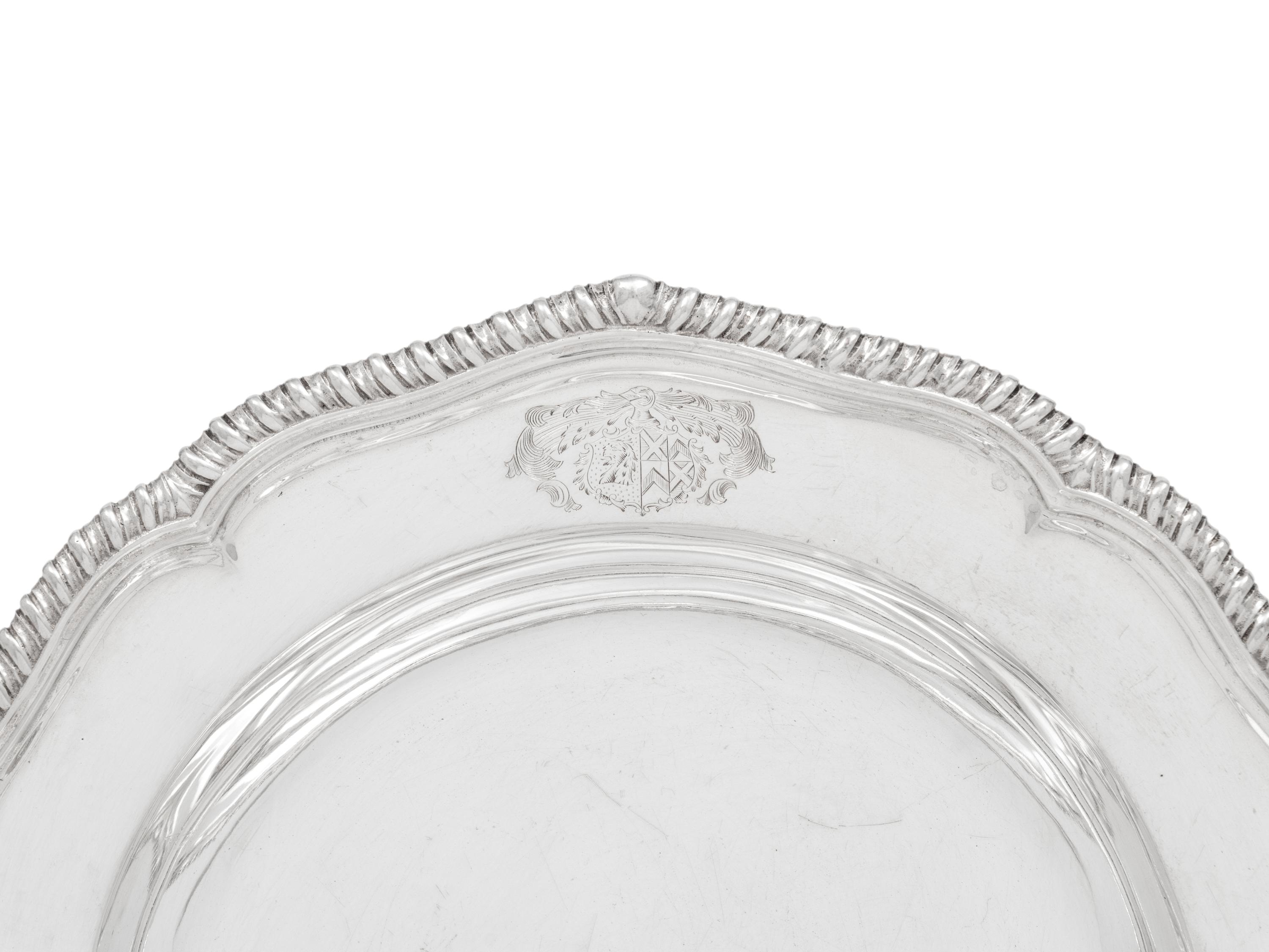 A Set of Twelve Silver Armorial Soup Plates