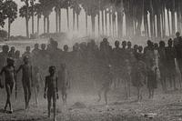 Sebastião Salgado (born 1944) The population of the cattle camp of Kenya walk toward the polio vaccinators as soon as they arrive, Maper Payem area, Rumbek District, Southern Sudan, 2001