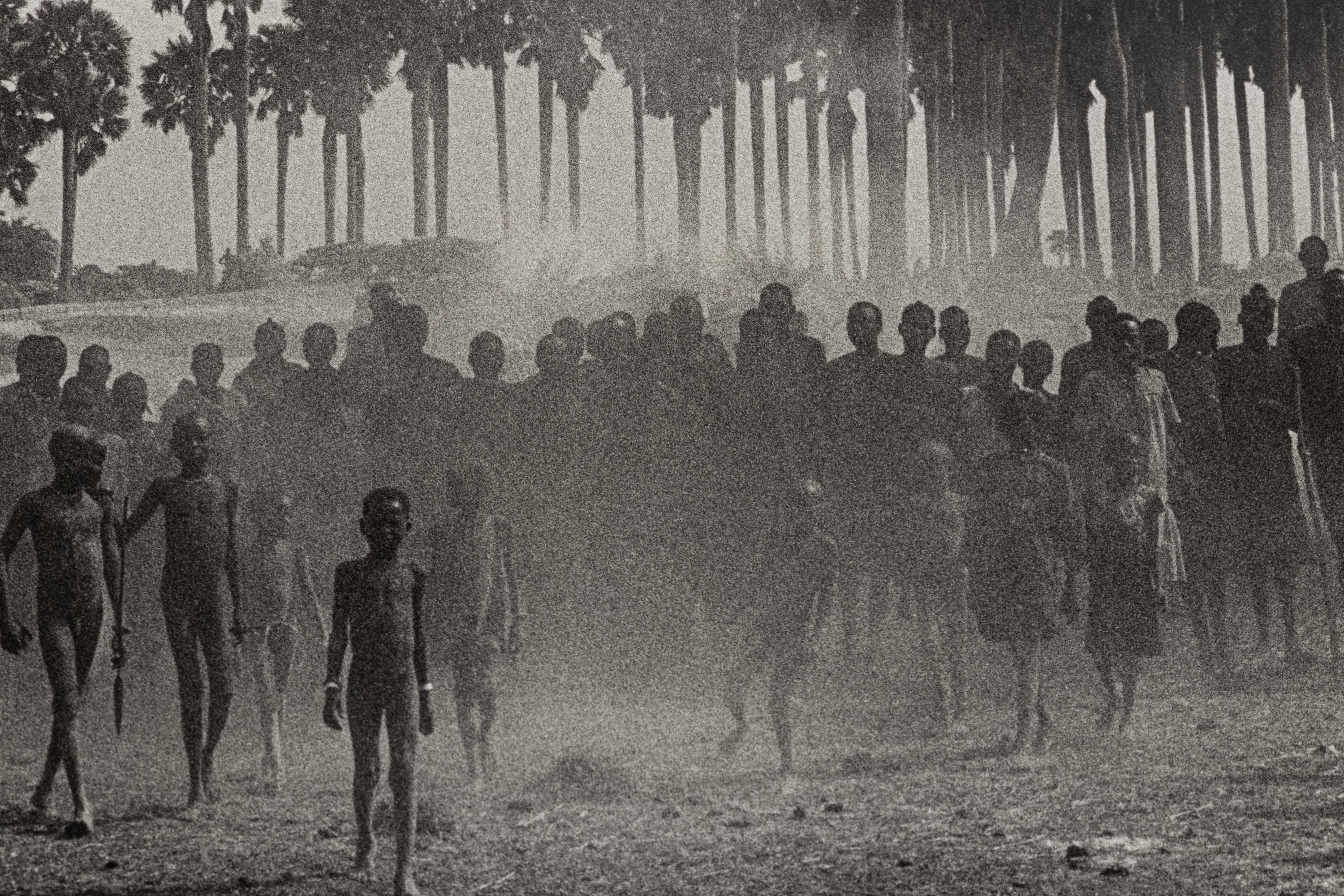 Sebastião Salgado (born 1944) The population of the cattle camp of Kenya walk toward the polio vaccinators as soon as they arrive, Maper Payem area, Rumbek District, Southern Sudan, 2001