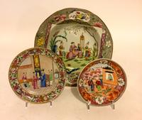 Two Chinese Export Porcelain Saucers with an Associated Bowl. Diameter of largest 9 1/2 inches.