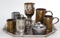 A Group of Pewter Mugs and Vessels Length of tray 17 3/4 inches.